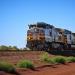 The Pilbara region is rich in minerals, in particular iron ore. The ore travels from the mines centred around Tom Price to the port of Dampier aboard gigantic trains. Each of these trains is made of 226 cars, reaches about 2.4 km in length and weighs 23,500 tons.