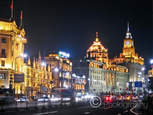 The Bund runs along the western bank of the Huangpu river. It faces the new district of Pudong.