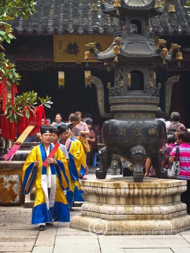 Taoist priests leading disciples in a Sunday religious ritual.