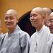 Candid shot of a group of monks visiting the Jade Buddha Temple in Shanghai.